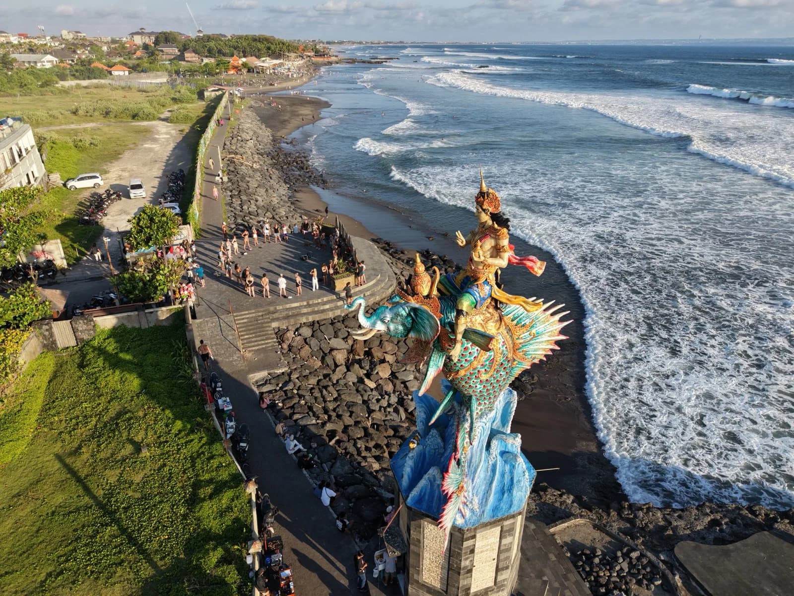 Dancing by the guardian statue